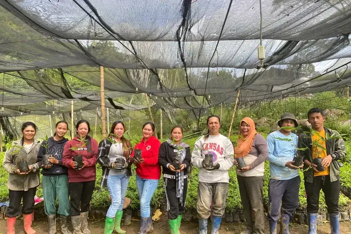 The planting team with seedlings at the nursery