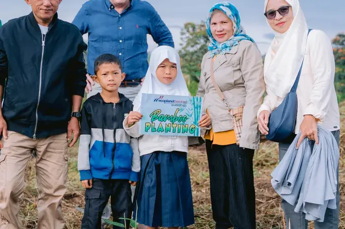 Children and guests at a community tree-planting day