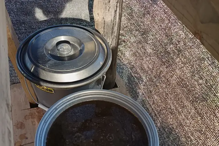 Worm tea and compost containers in the vermiculture shed